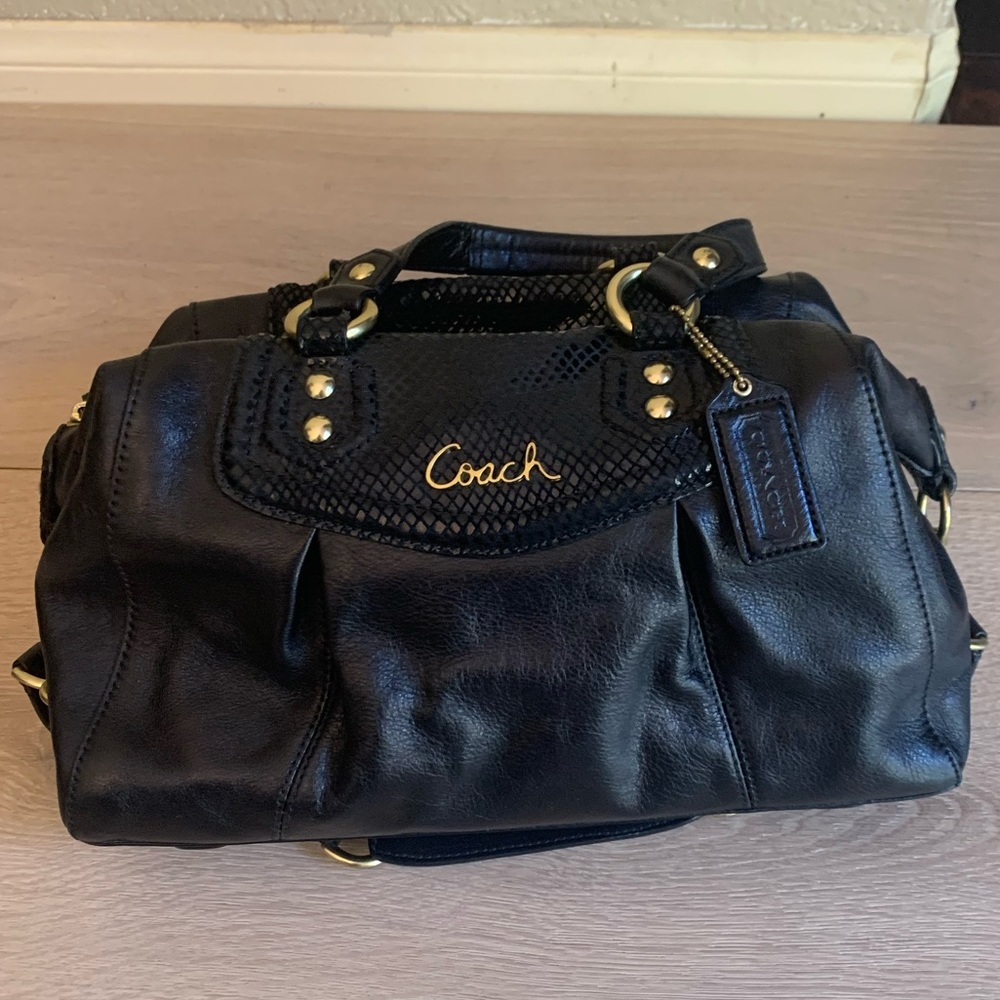 Coach leather purse with gold buckles. Excellent condition